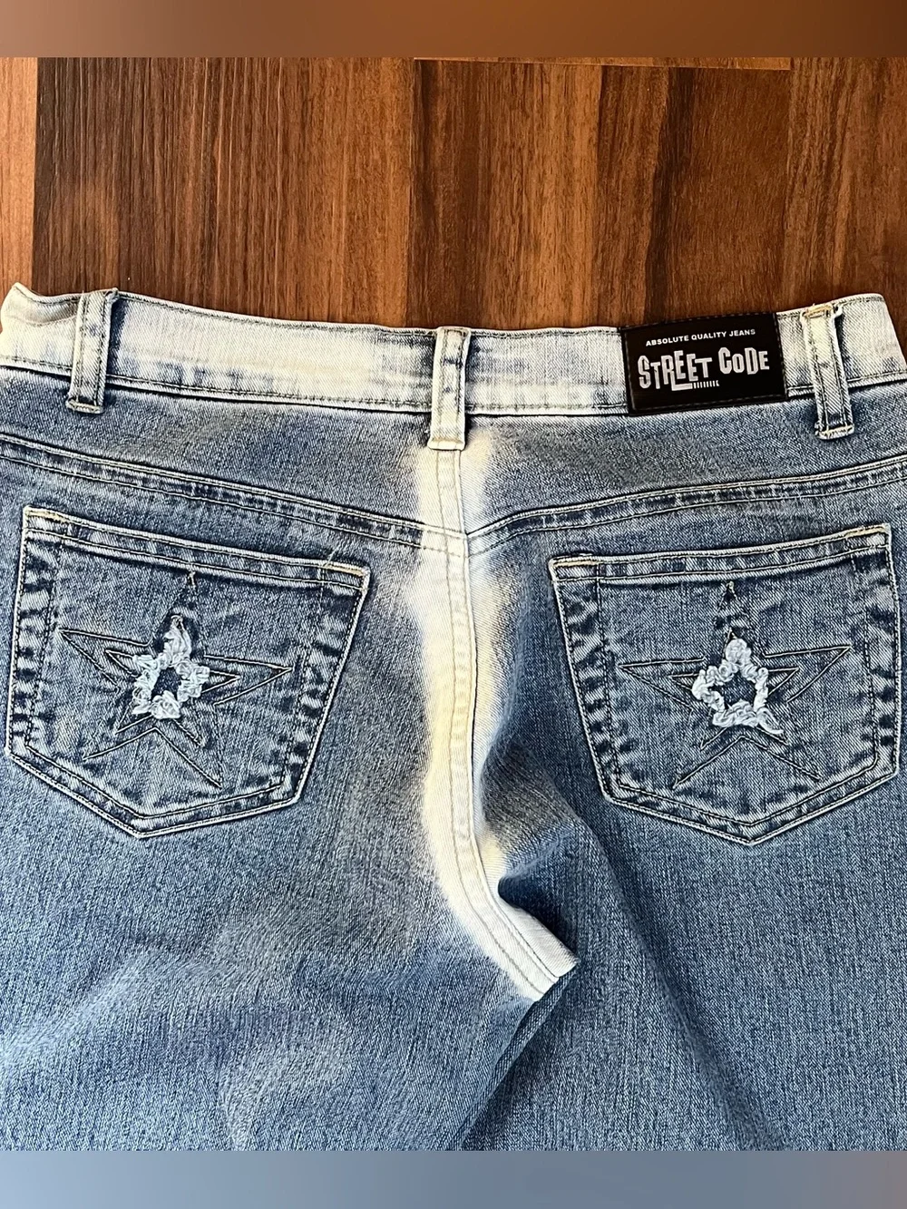 Vintage Y2K Street Code jeans with distressed star patch details
